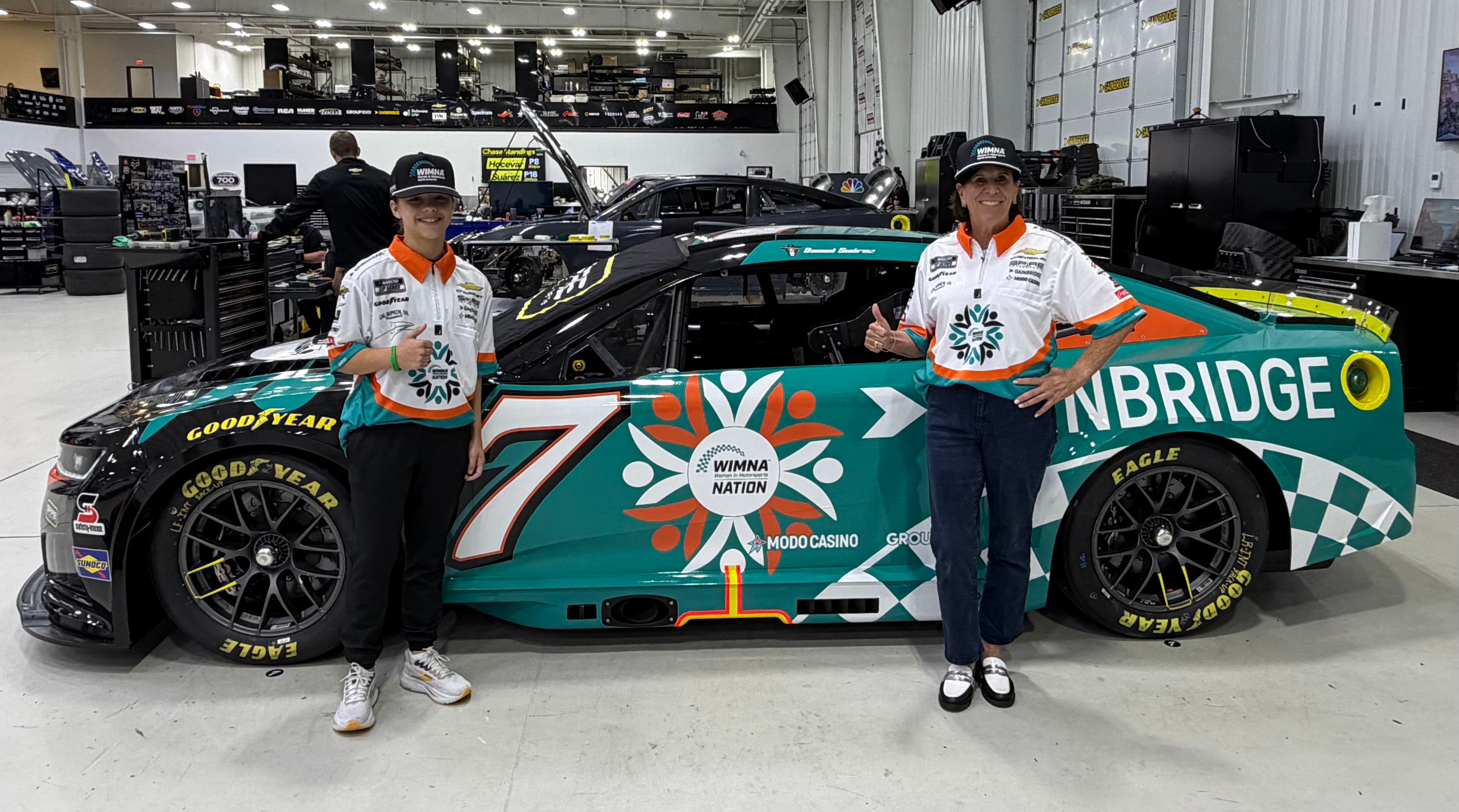 Autumn with Cindy Sisson, Executive Director of WIMNA, alongside the No. 7 WIMNA Nation car at Spire Motorsports