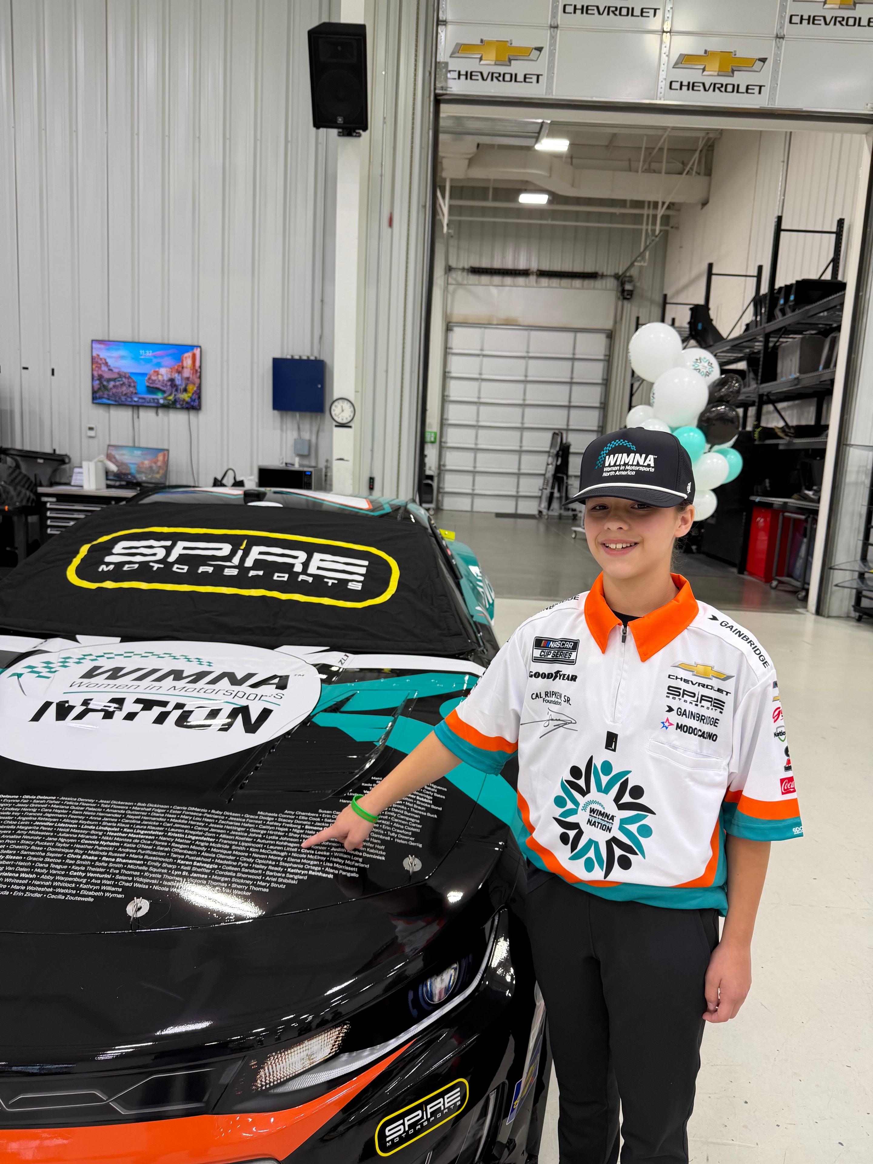 Autumn with the No. 7 WIMNA Nation Chevrolet at Spire Motorsports headquarters, Mooresville NC